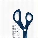 An icon of a tape measure and scissors